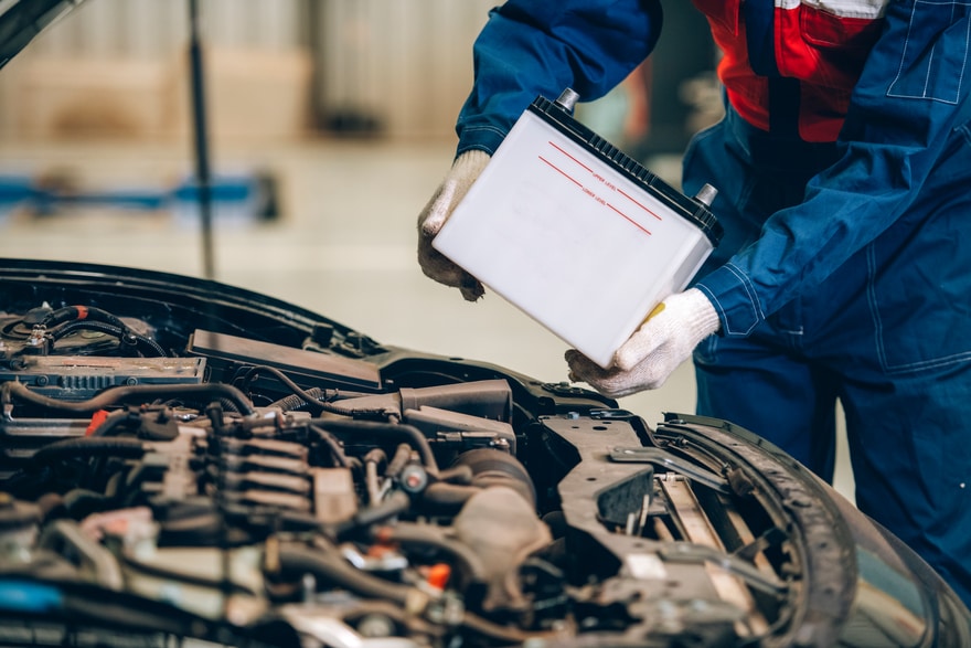Hiring a professional for home car battery replacement
